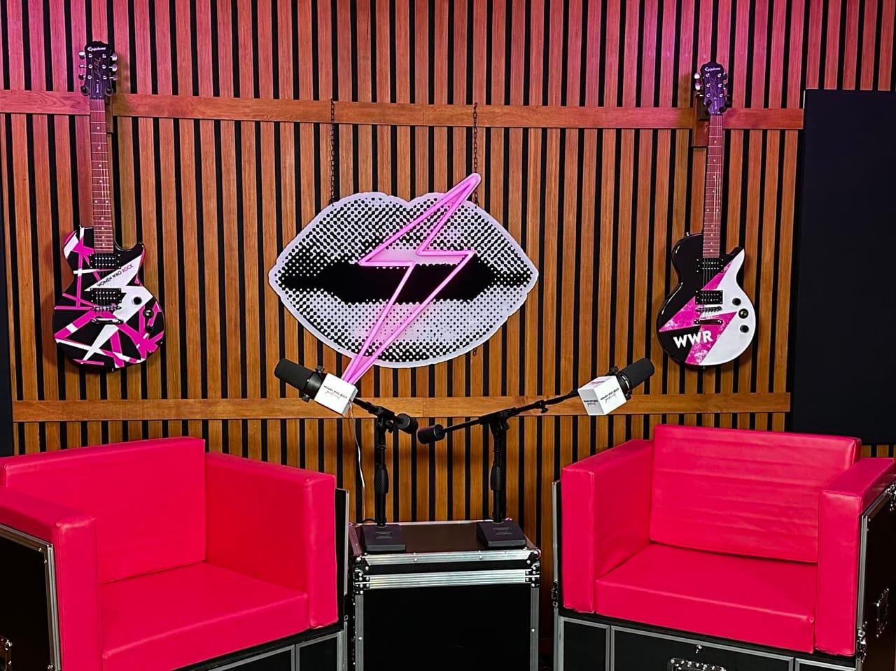 Branded microphones on the Women Who Rock set, under the neon lips logo